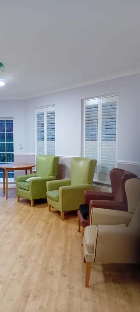 Plantation shutters in a care home lounge