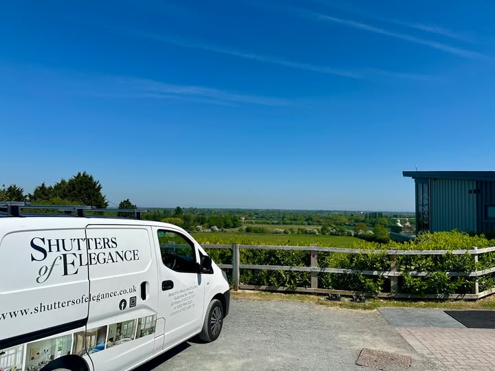Landmark Café interior with shutters partially open revealing the compass logo