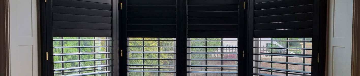 Dark Shutters on a white frame