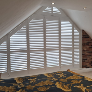 Unique shaped Shutters on a huge bedroom window