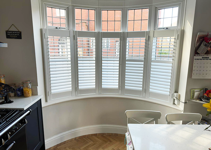 Ashwood Shutters installed in a beautiful Kitchen bay window