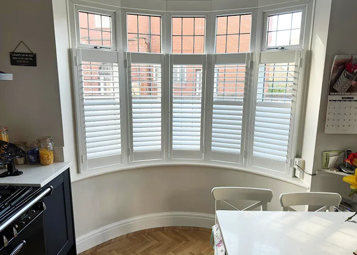 Ashwood Shutters installed in a beautiful Kitchen bay window