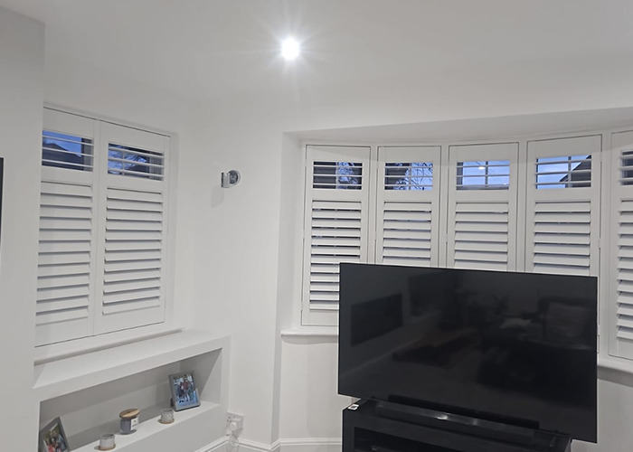 Ashwood Shutters in a bay window