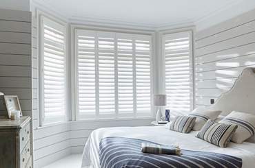 Full height, Classic Shutters in a Bedroom