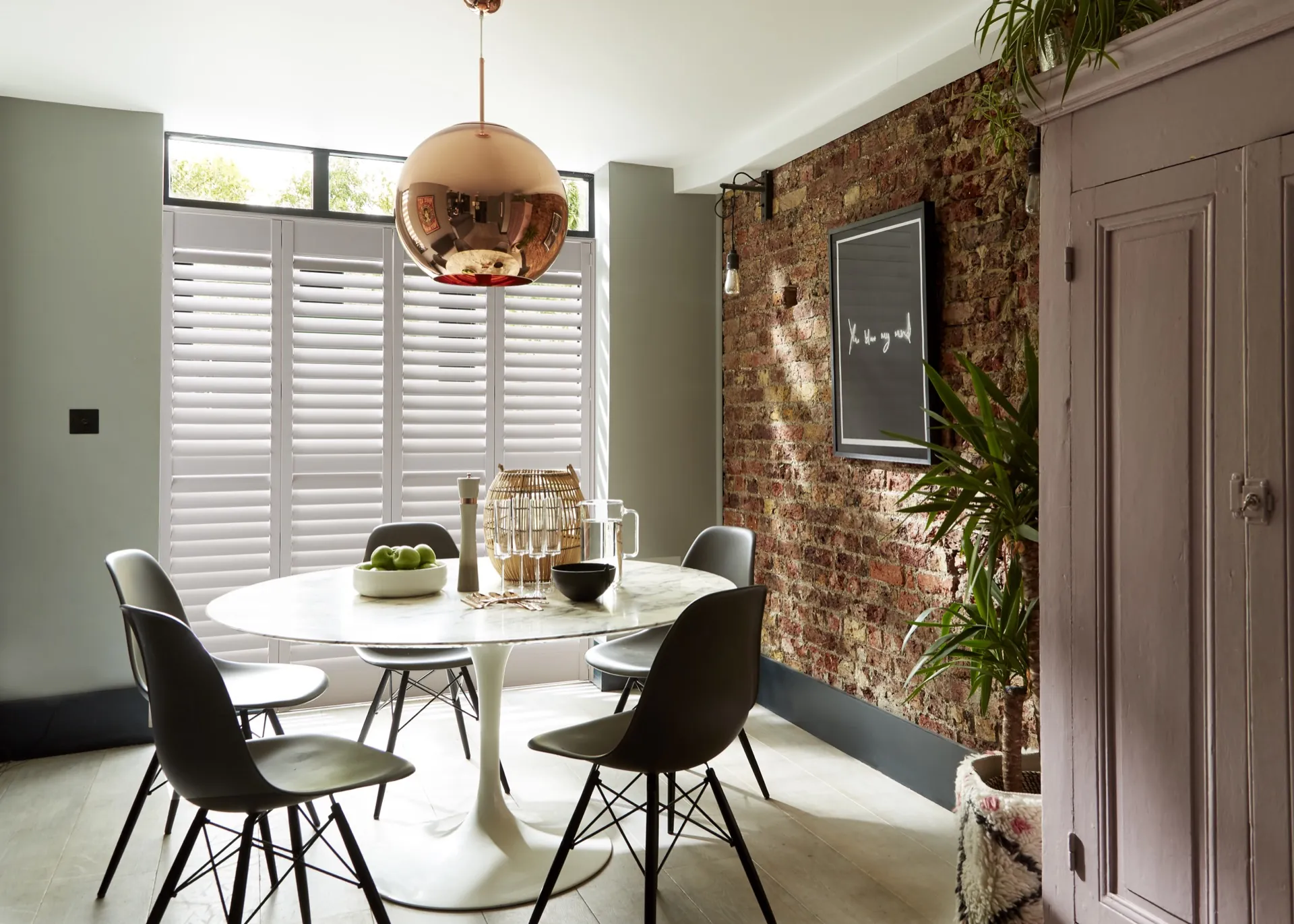 Crisp pure white shutters fitted inside a coloured window frame