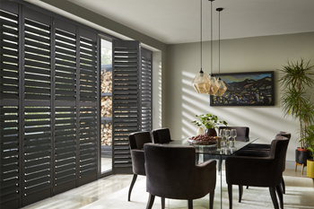 Dark coloured, full height Shutters in a Dining Room