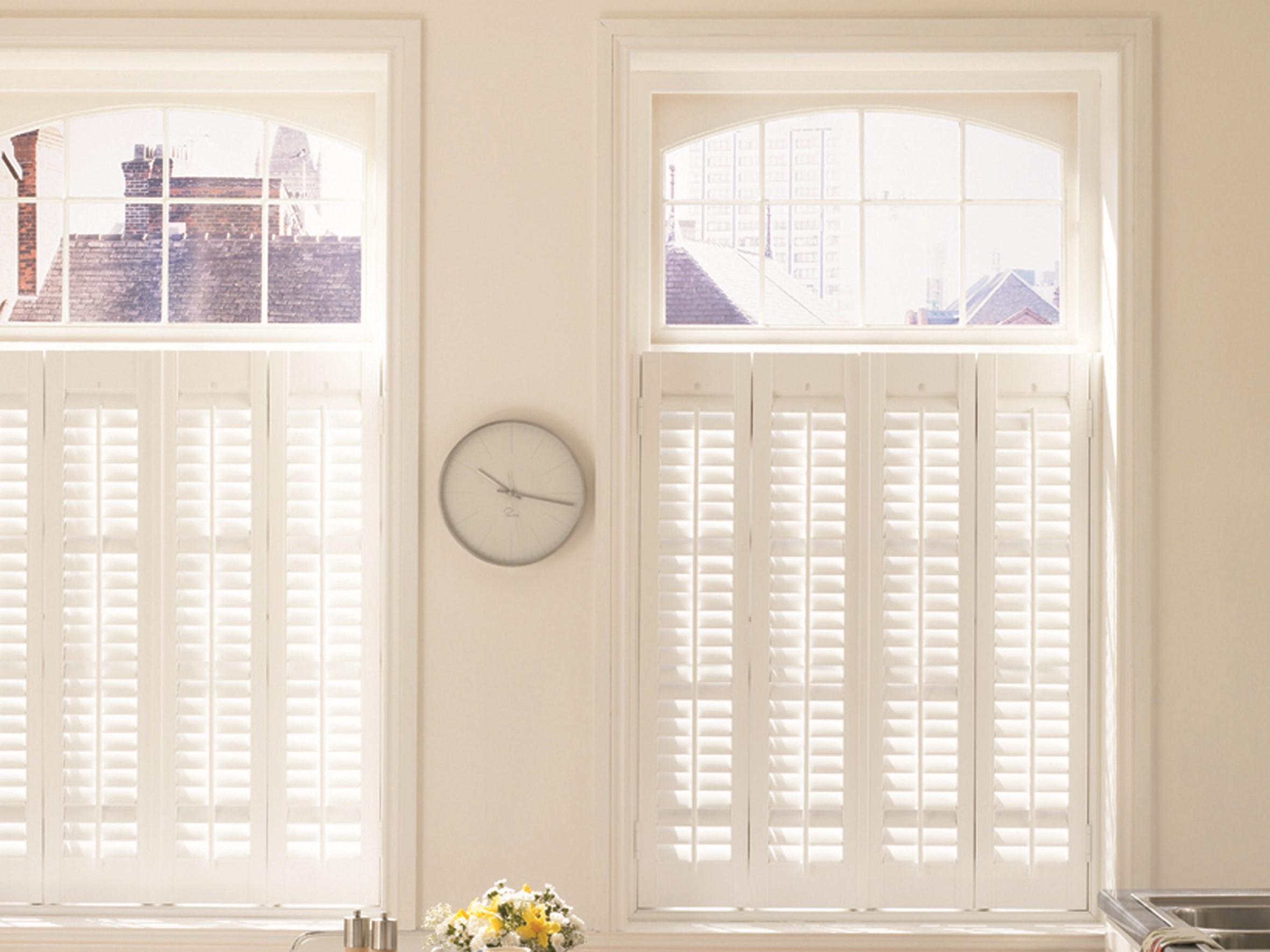 Two sets of Vienna Shutters in a large window