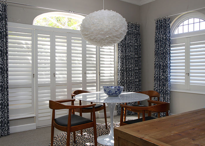 Large, full-height Portchester Shutters covering french doors