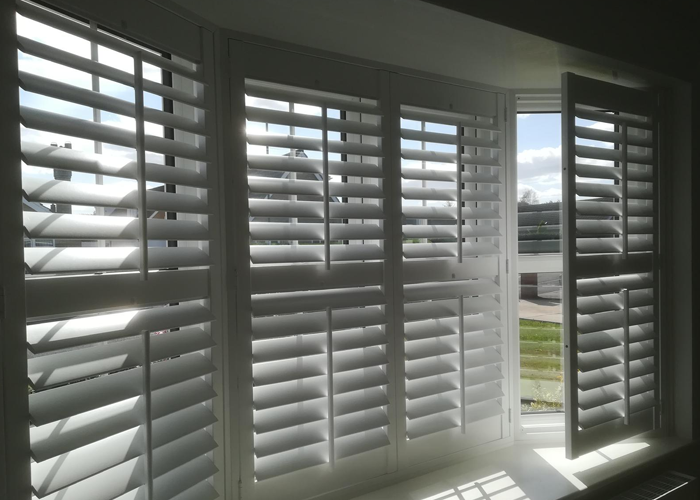 Worcester Shutters in a Bay Window, with the right panel opened