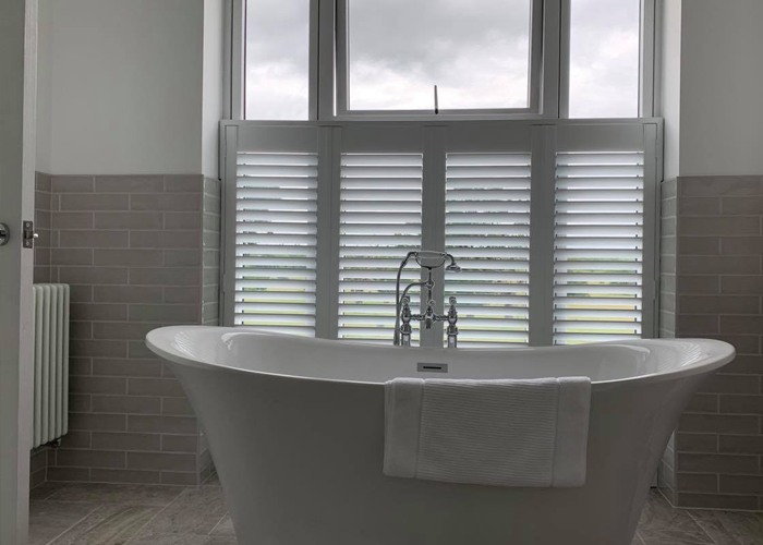 Worcester Shutters in a Bathroom, with a roll-top bath