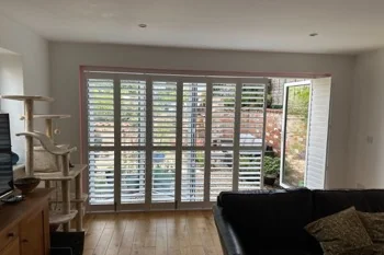 Door shutters for bi-fold, patio and French doors on a tracked system