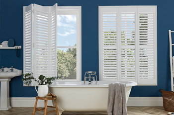 Full Height Shutters in a modern, blue Bathroom