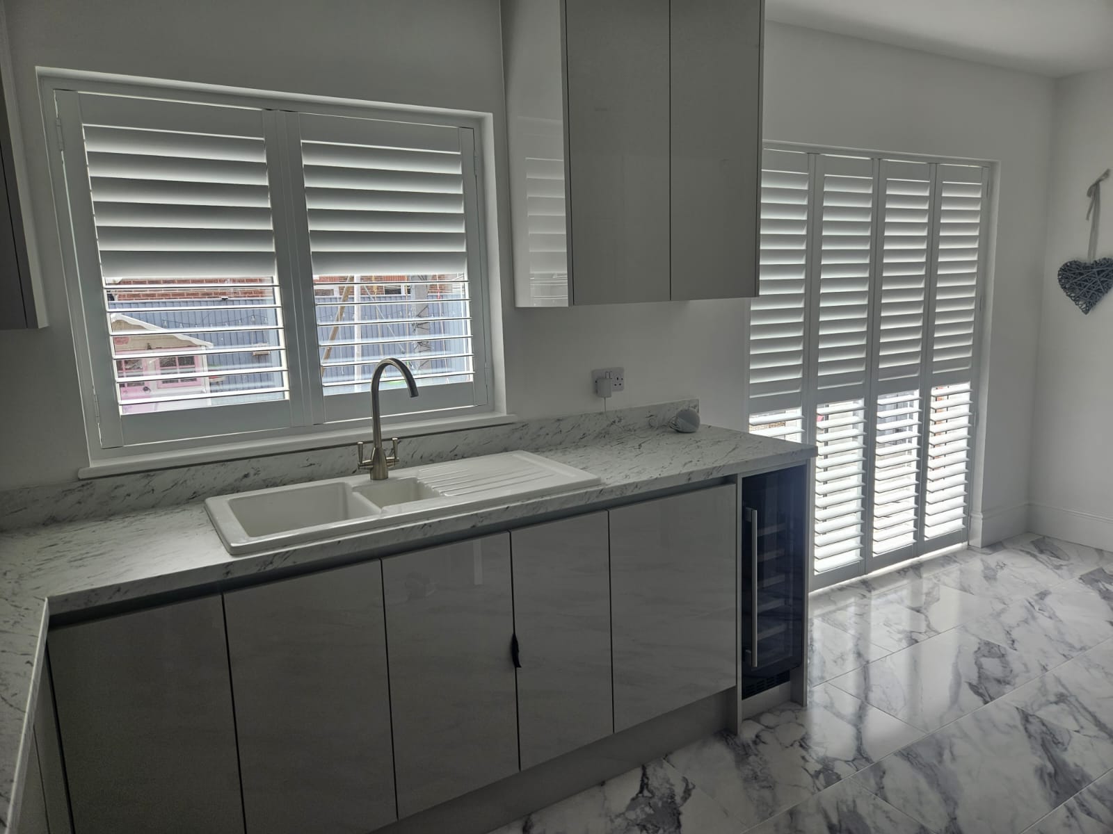 Image of plantation shutters in a customer's kitchen